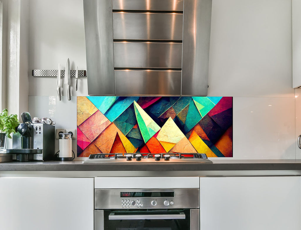 a kitchen with stainless steel appliances and a colorful painting on the wall