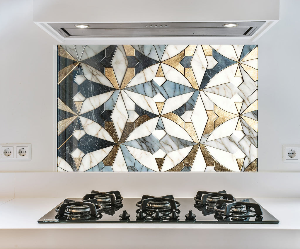 a kitchen with a stove top and a mosaic design on the wall