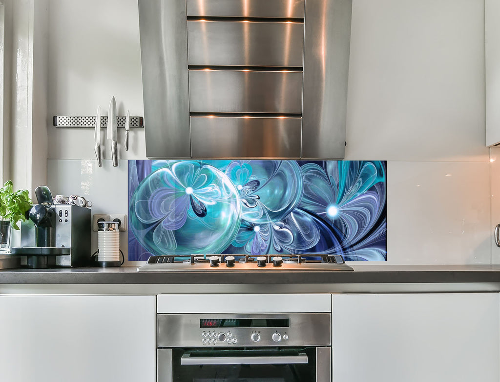 a kitchen with stainless steel appliances and a painting on the wall