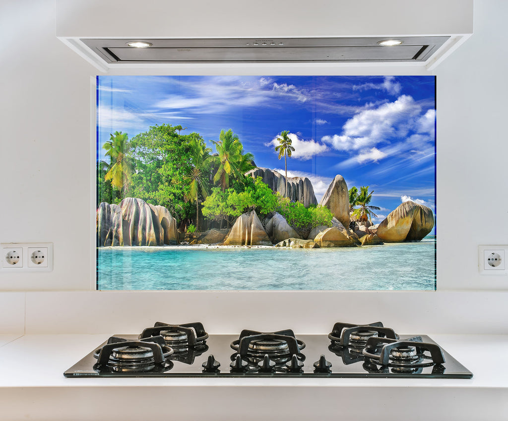 a picture of a tropical island is on the wall of a kitchen