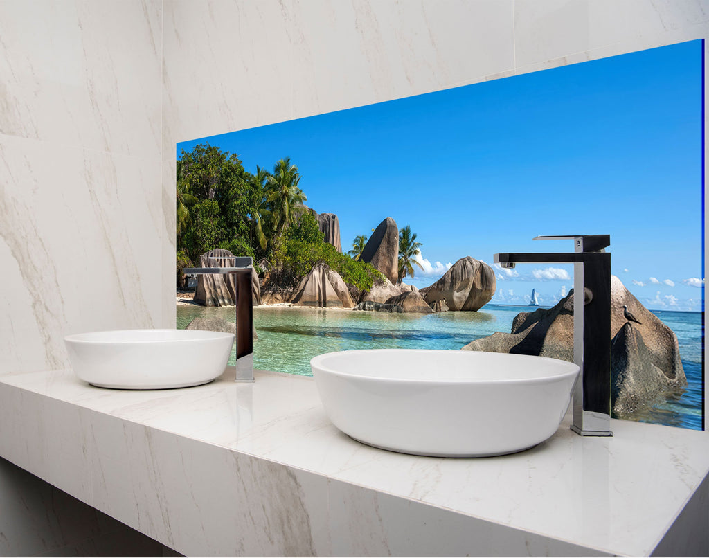 two white bowls on a counter in a bathroom