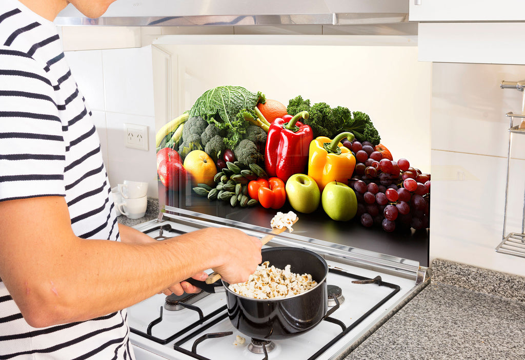 a person cooking food on a stove top