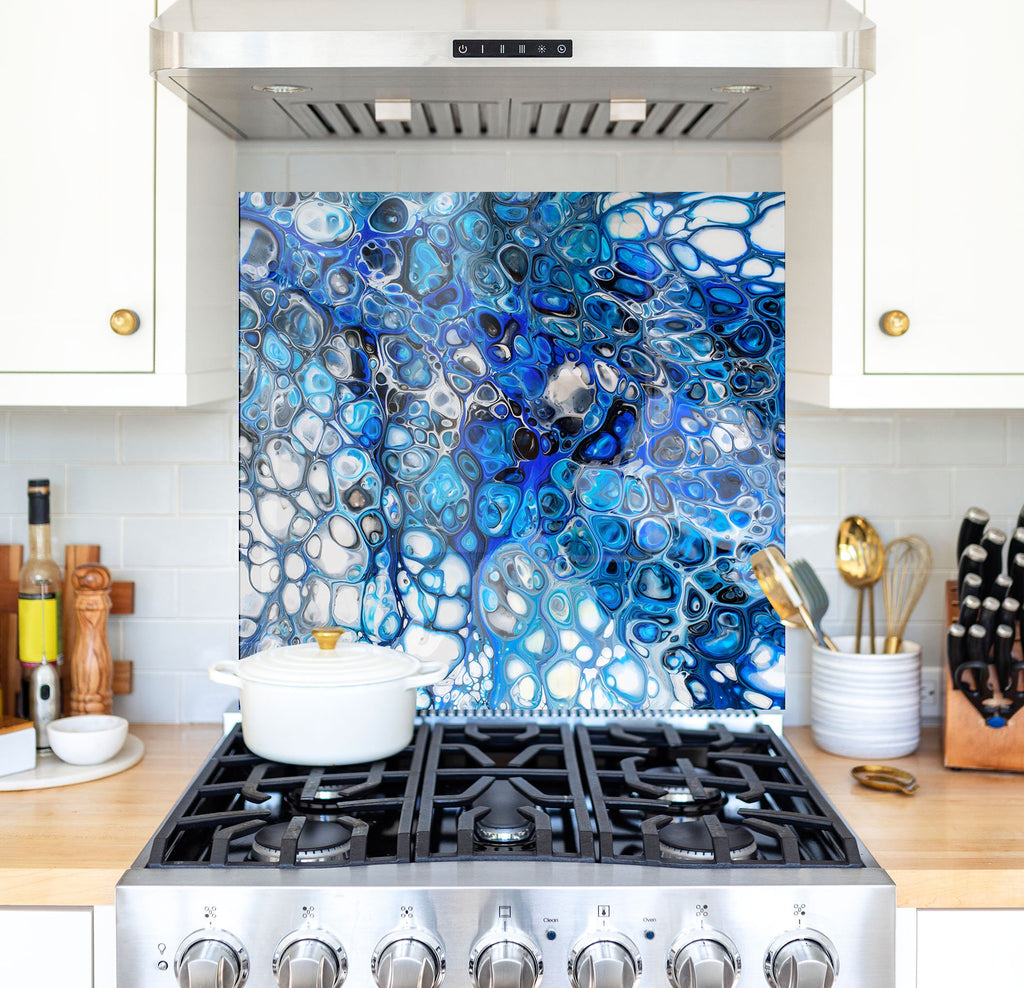 a stove top oven sitting inside of a kitchen