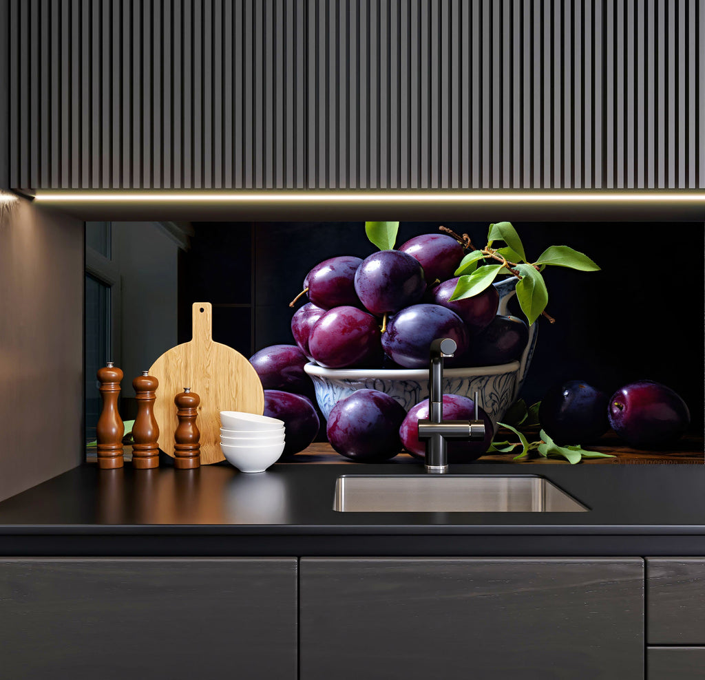 a kitchen sink with a bowl of plums and a cutting board