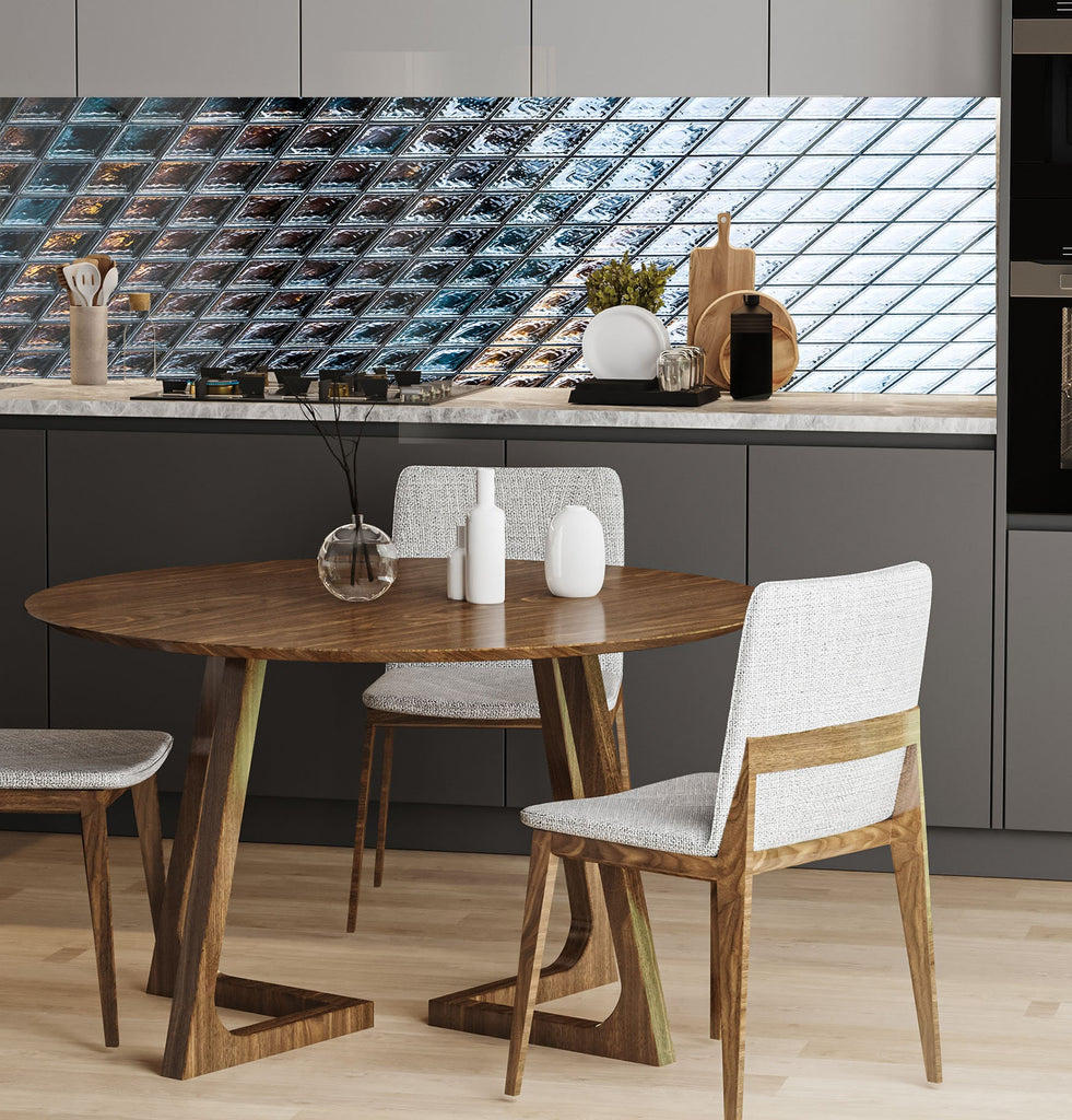 a kitchen with a wooden table and white chairs