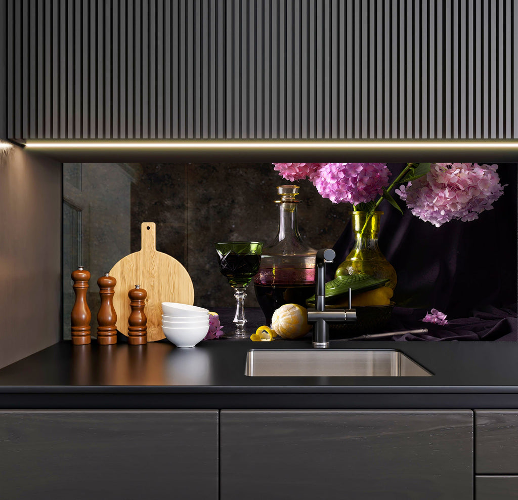 a kitchen with a sink, cutting board and flowers