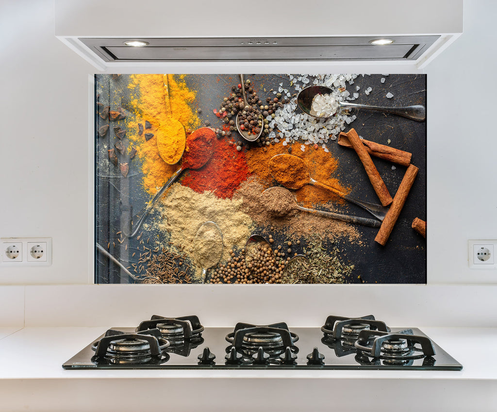 a picture of spices on a wall above a stove