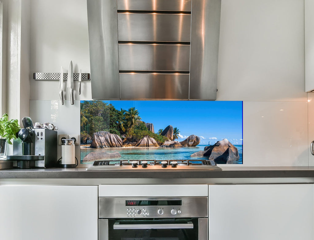 a flat screen tv sitting on top of a kitchen counter