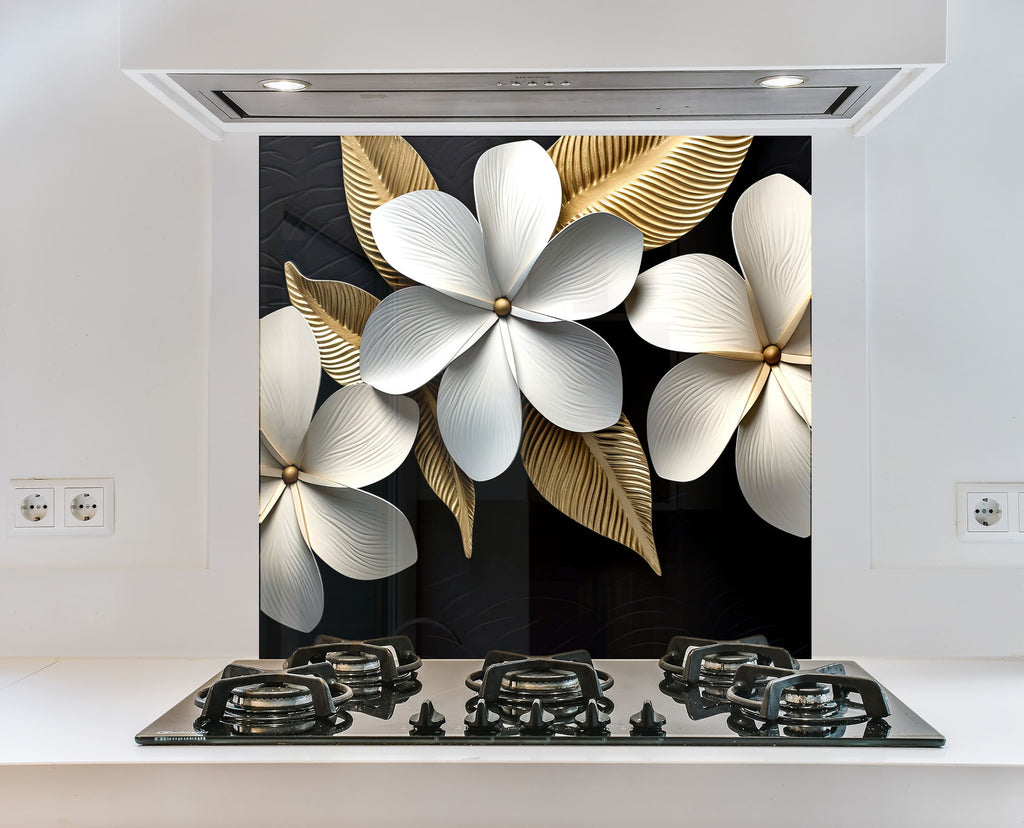 a stove top with a painting of white flowers on it