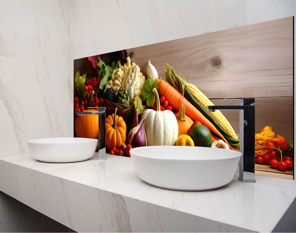 two bowls of fruit and vegetables on a counter