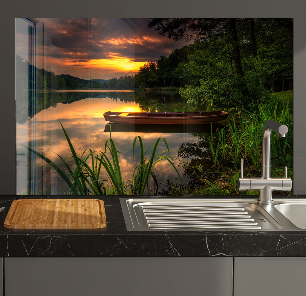 a kitchen counter with a sink and a cutting board