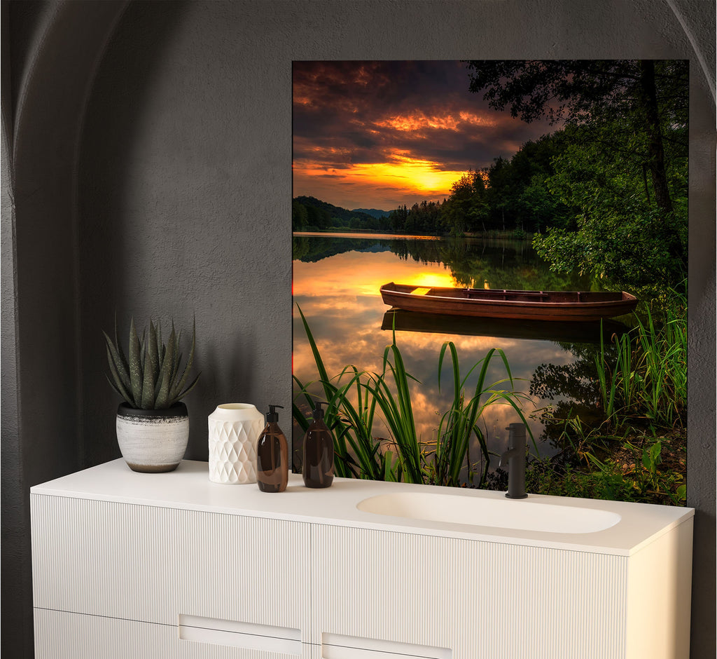 a painting of a boat on a lake at sunset