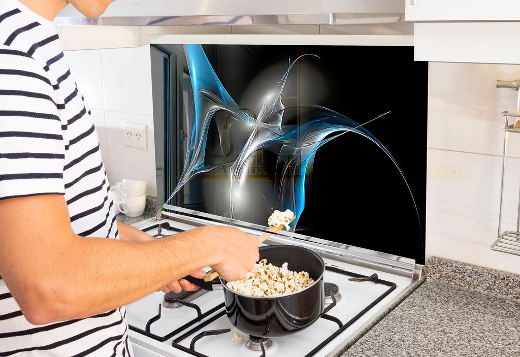 a man is cooking popcorn on the stove