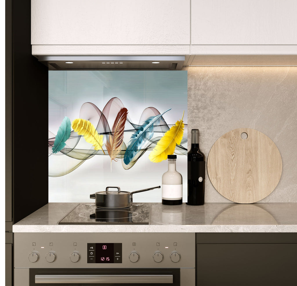 a stove top oven sitting under a picture of feathers