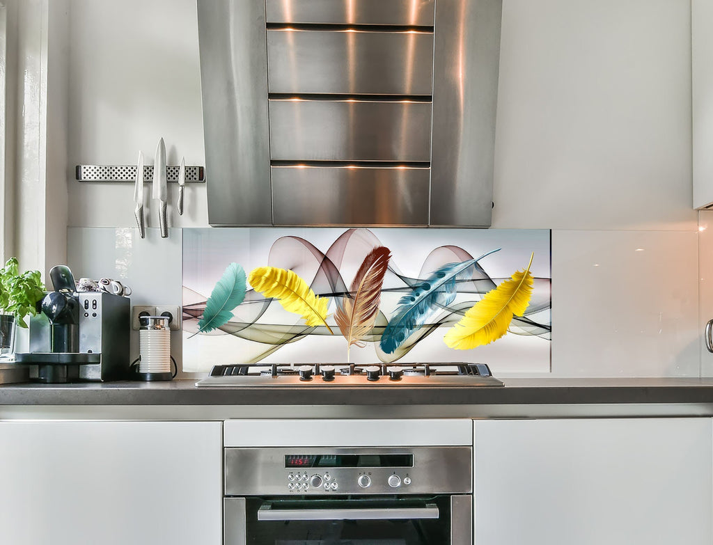 a stainless steel stove top oven sitting under a painting