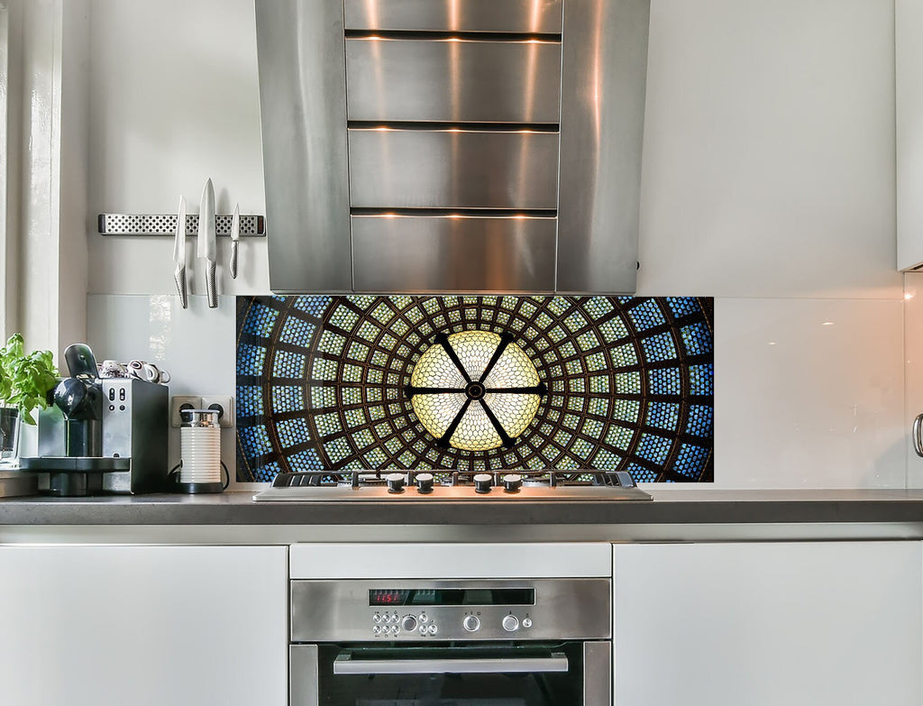 a stove top oven sitting inside of a kitchen