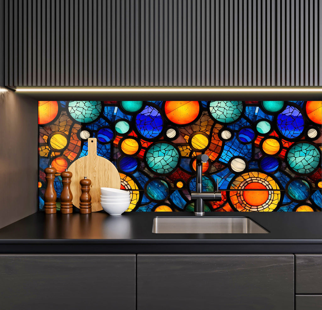 a kitchen counter with a sink under a stained glass window