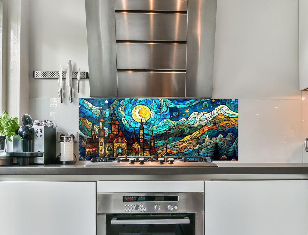 a kitchen with stainless steel appliances and a painting on the wall