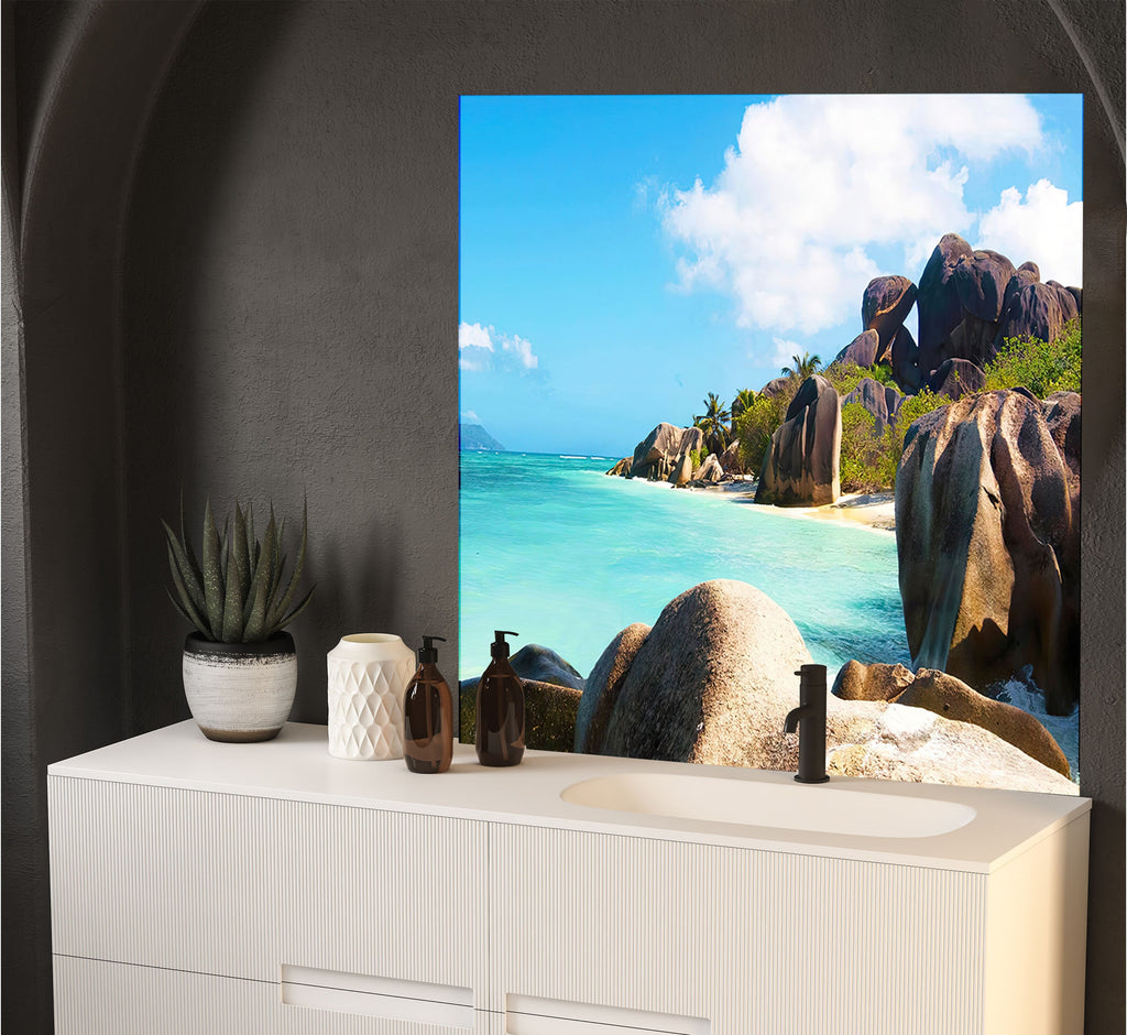 a bathroom with a large picture of a beach on the wall