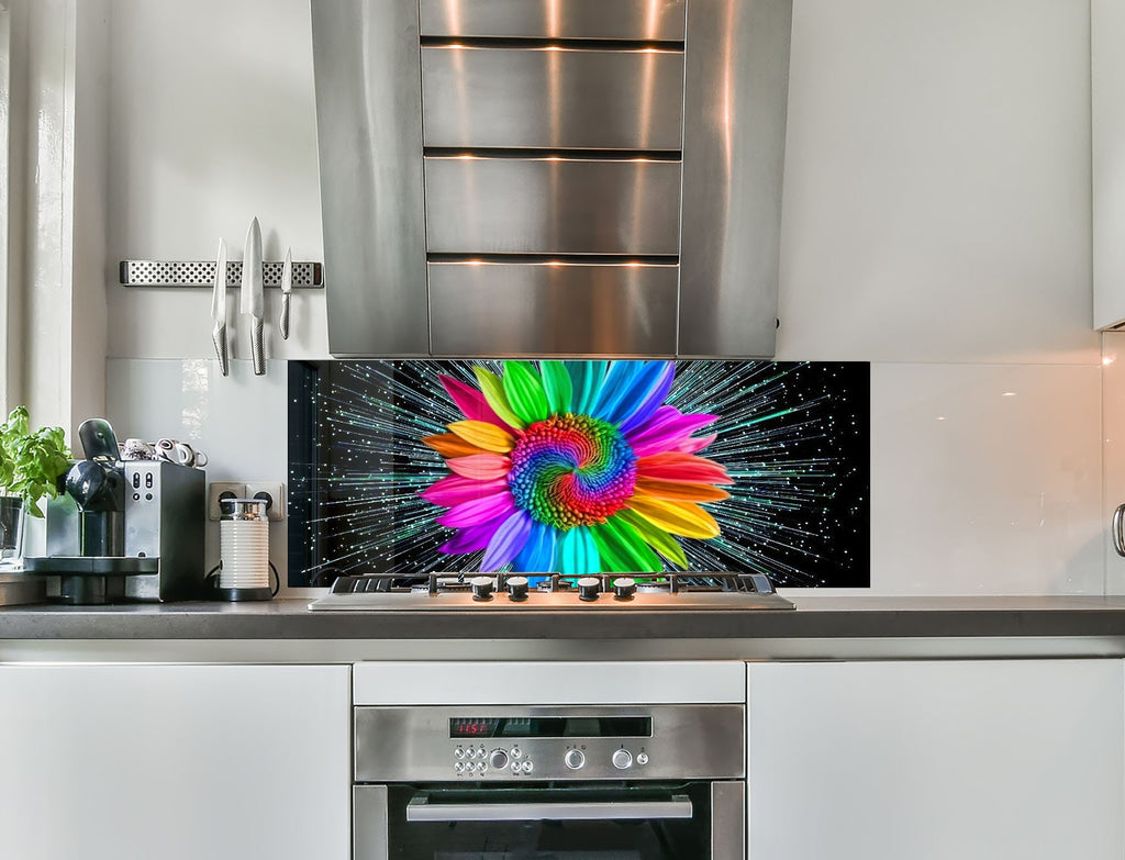 a kitchen with a stove top oven and a large tv on the wall