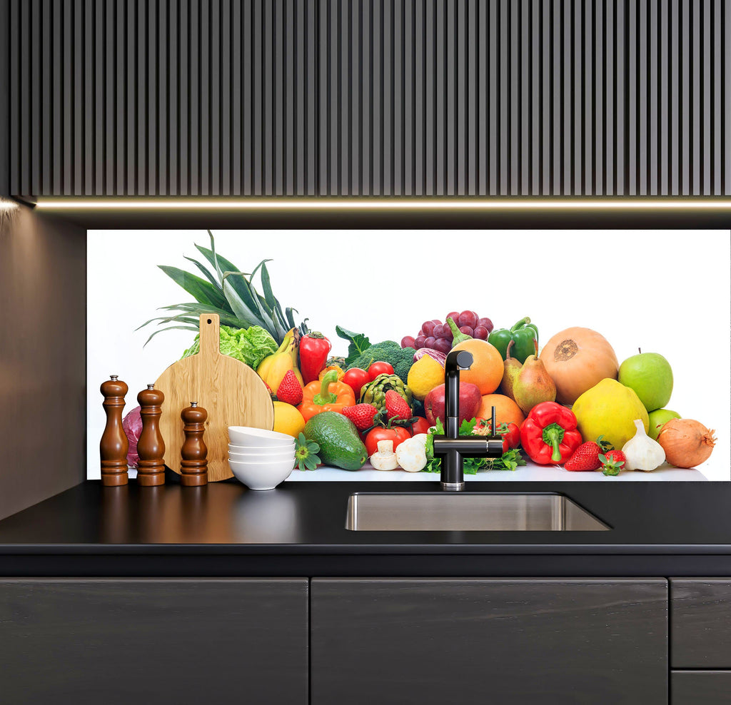 a kitchen counter with a sink and a bunch of fruits and vegetables on it