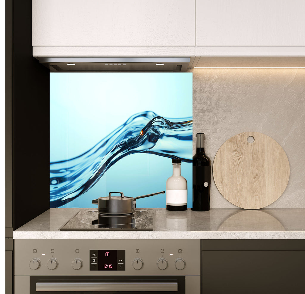 a stove top oven sitting under a picture of a wave