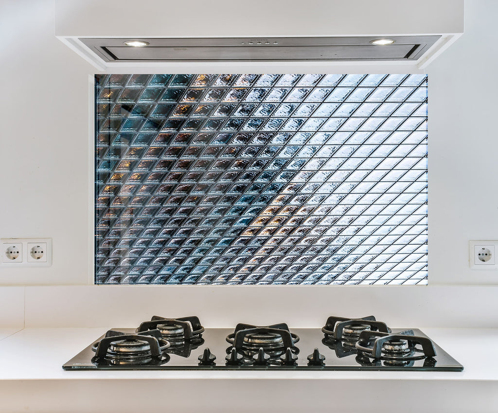 a kitchen with a stove top and a window