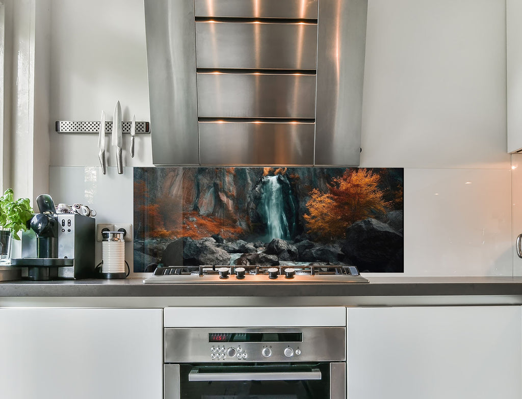 a kitchen with stainless steel appliances and a painting on the wall