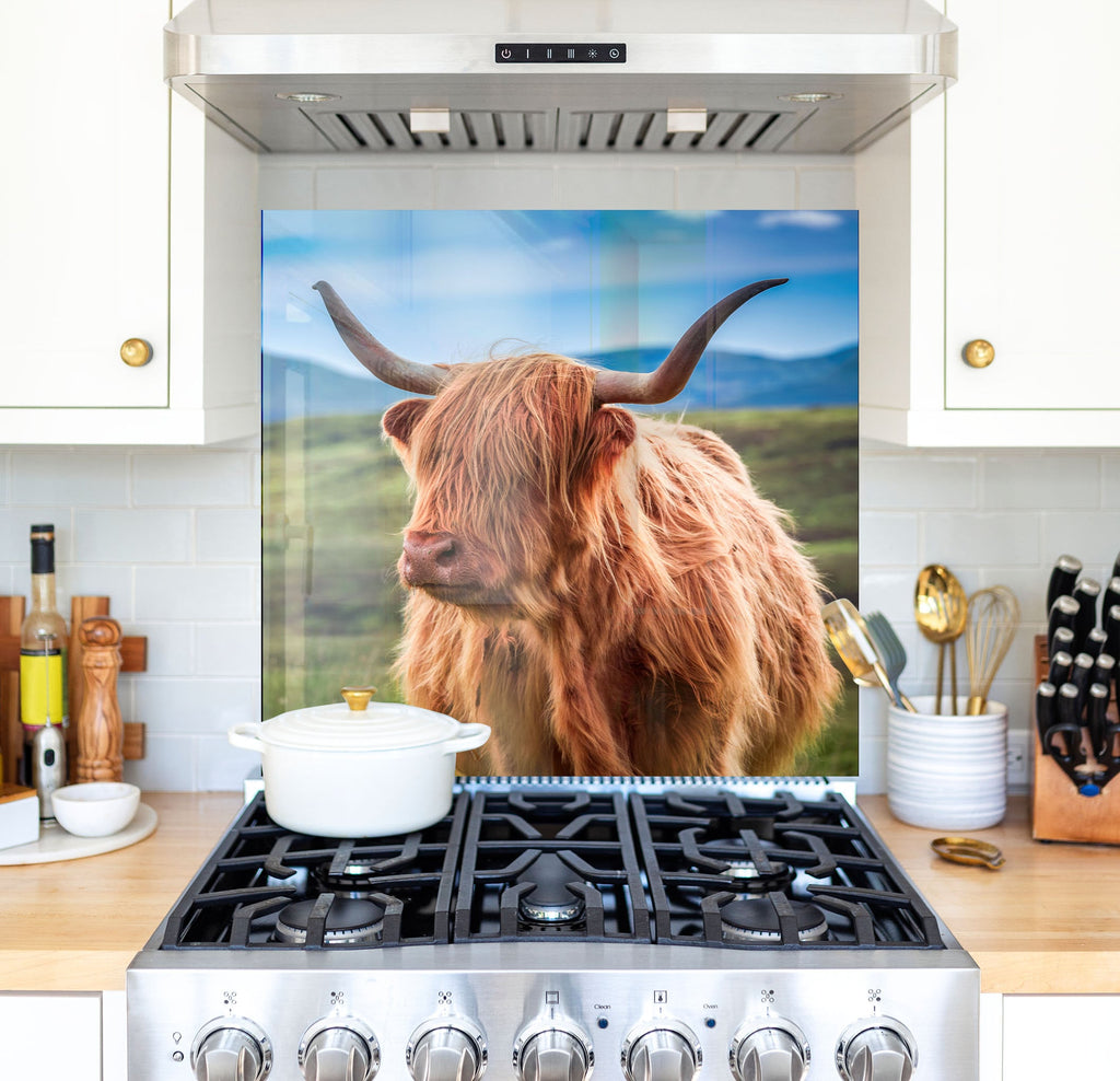 a picture of a cow is on the back of a stove