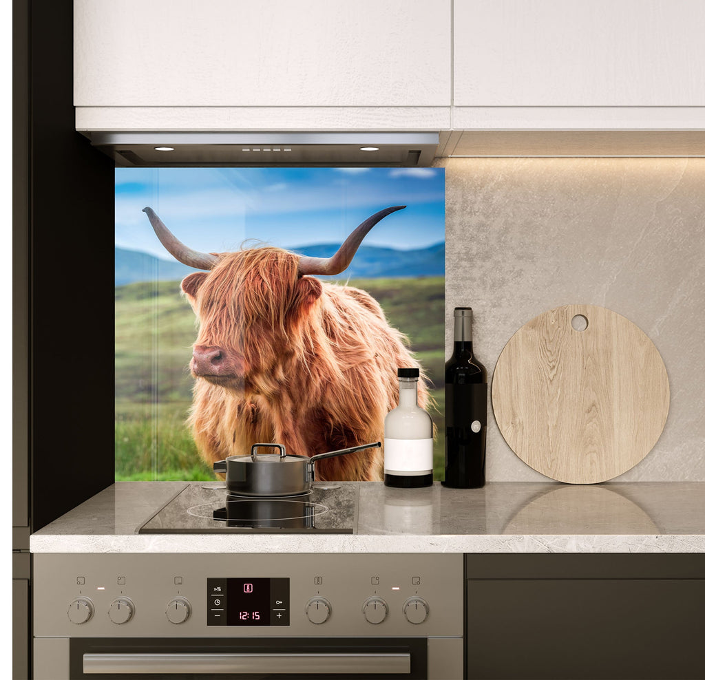 a picture of a cow is on the wall of a kitchen