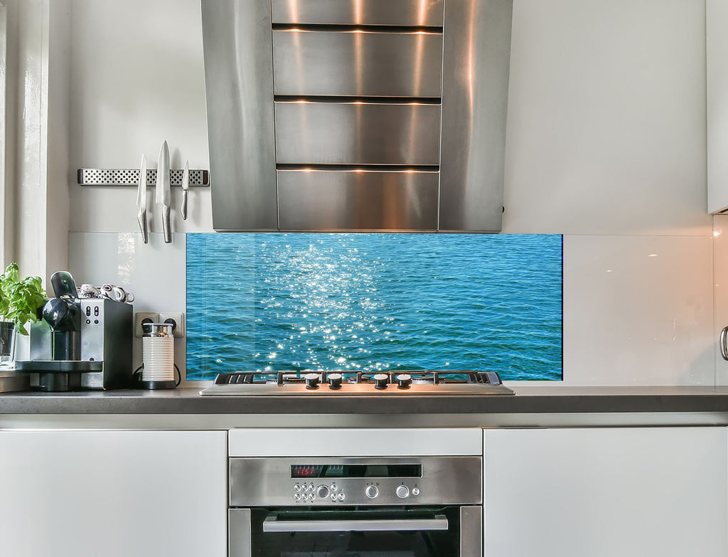 a stainless steel stove top oven sitting inside of a kitchen