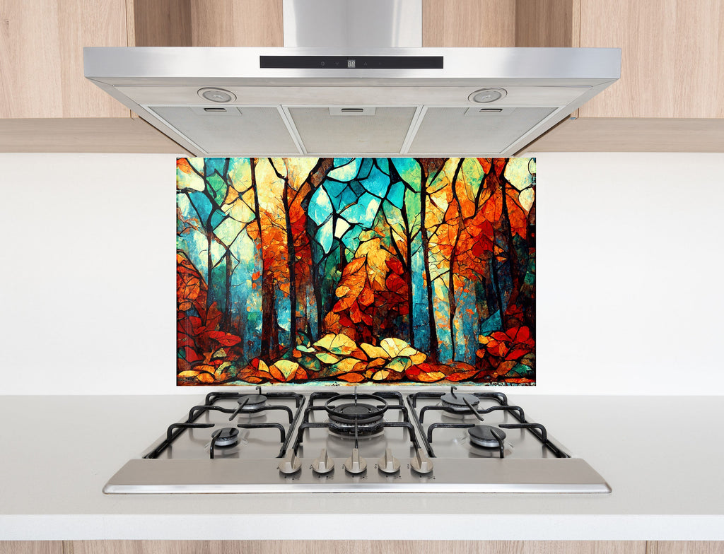 a painting of a forest is on a stove top