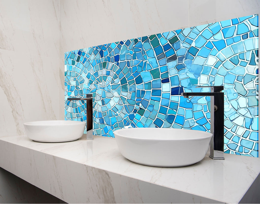 a bathroom with two sinks and a mosaic tile wall