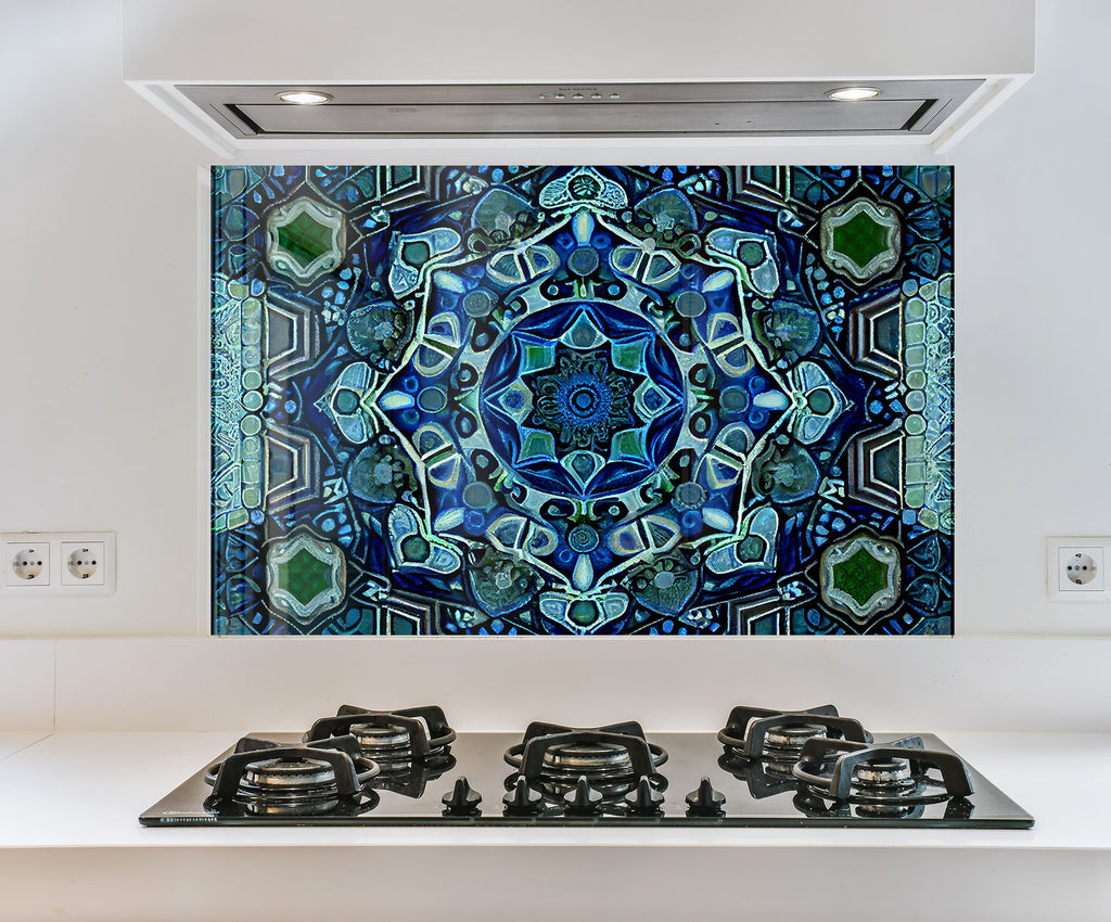 a picture of a blue and green design on a wall above a stove