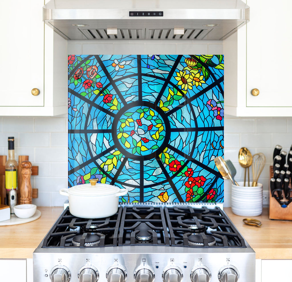 a stove top oven sitting under a stained glass window