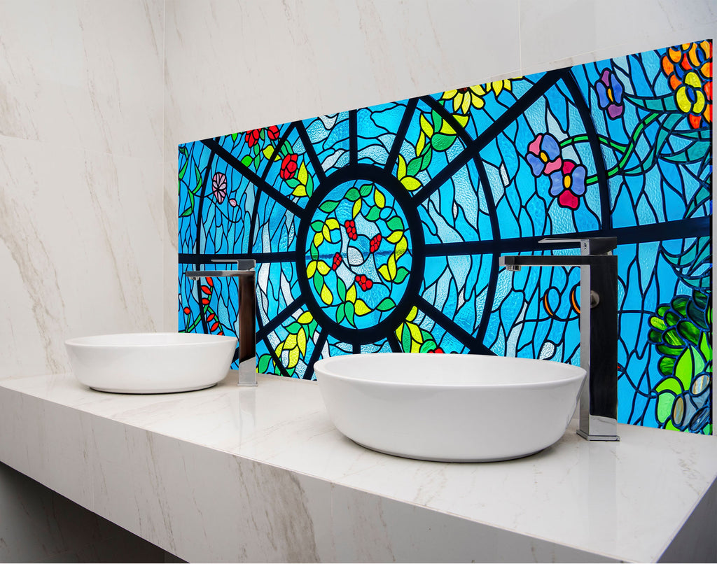 two white bowls on a counter in front of a stained glass window