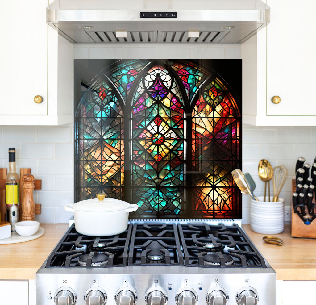 a stove top oven sitting under a stained glass window